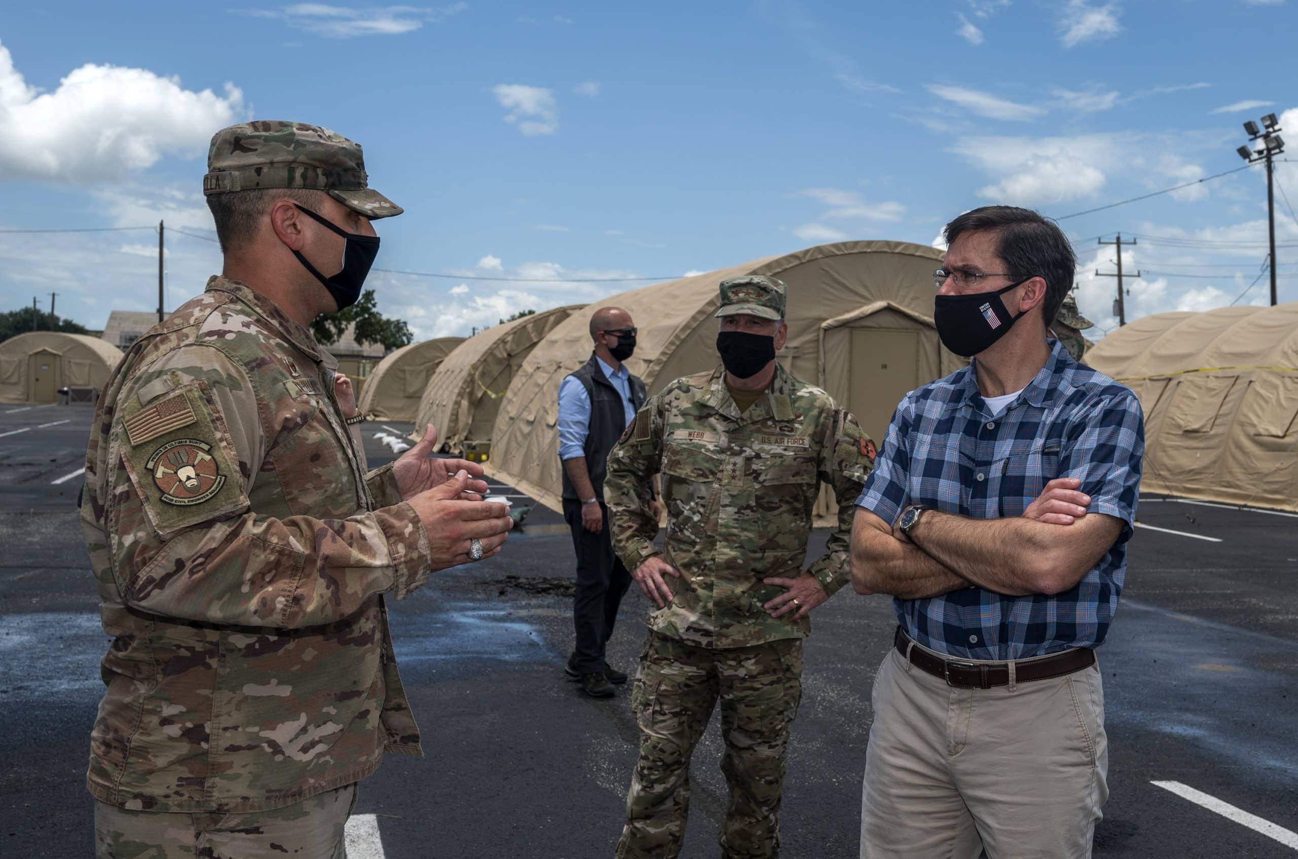 Lt. Col. Joey Tortella, 902nd Civil Engineer Squadron commander, briefs U.S. Secretary of Defense Dr. Mark T. Esper and Lt. Gen. Brad Webb, commander of Air Education and Training Command, during a tour of the U.S. Air Force basic military training's Basic Expeditionary Airfield Resources base June 16, 2020, at Joint Base San Antonio-Lackland, Texas. Esper met with AETC leaders to see firsthand how BMT is fighting through COVID-19 with health protection measures in place and adapting operations to current Centers for Disease Control and Prevention Guidance. The visit also allowed him to witness how a citizen becomes an Airman during COVID-19.