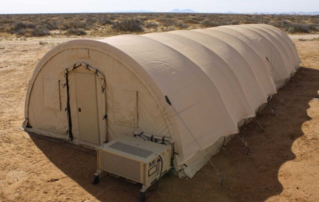 Exterior of Alaska Small Shelter System® configured and equipped with Alaska EnerLayer® and the Alaska Solar Fly®